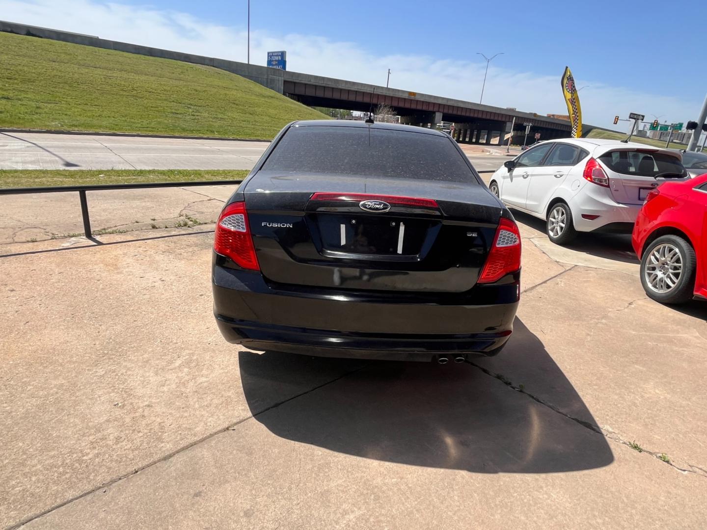 2012 BLACK FORD FUSION SE SE (3FAHP0HAXCR) with an 2.5L L4 DOHC 16V engine, located at 8101 E. Skelly Dr., Tulsa, OK, 74129, (918) 592-3593, 36.121891, -95.888802 - Photo#2